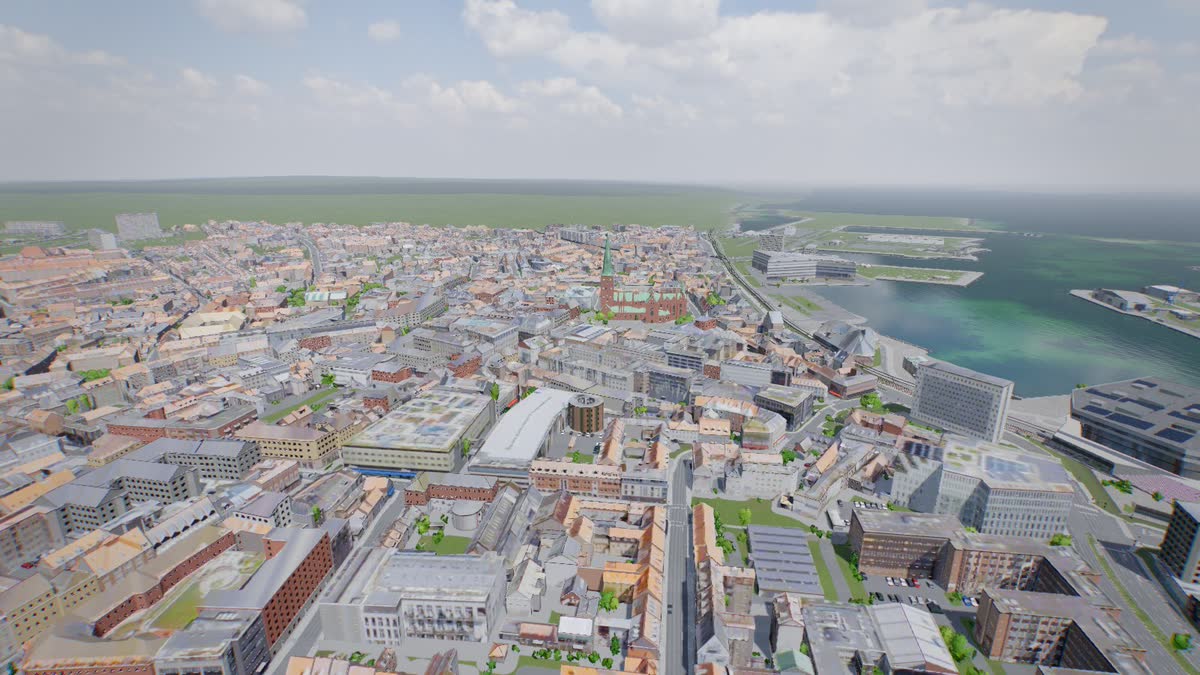 Aarhus midtby fra luften: tegltage og facader, gader, domkirken, havnen og bugten.